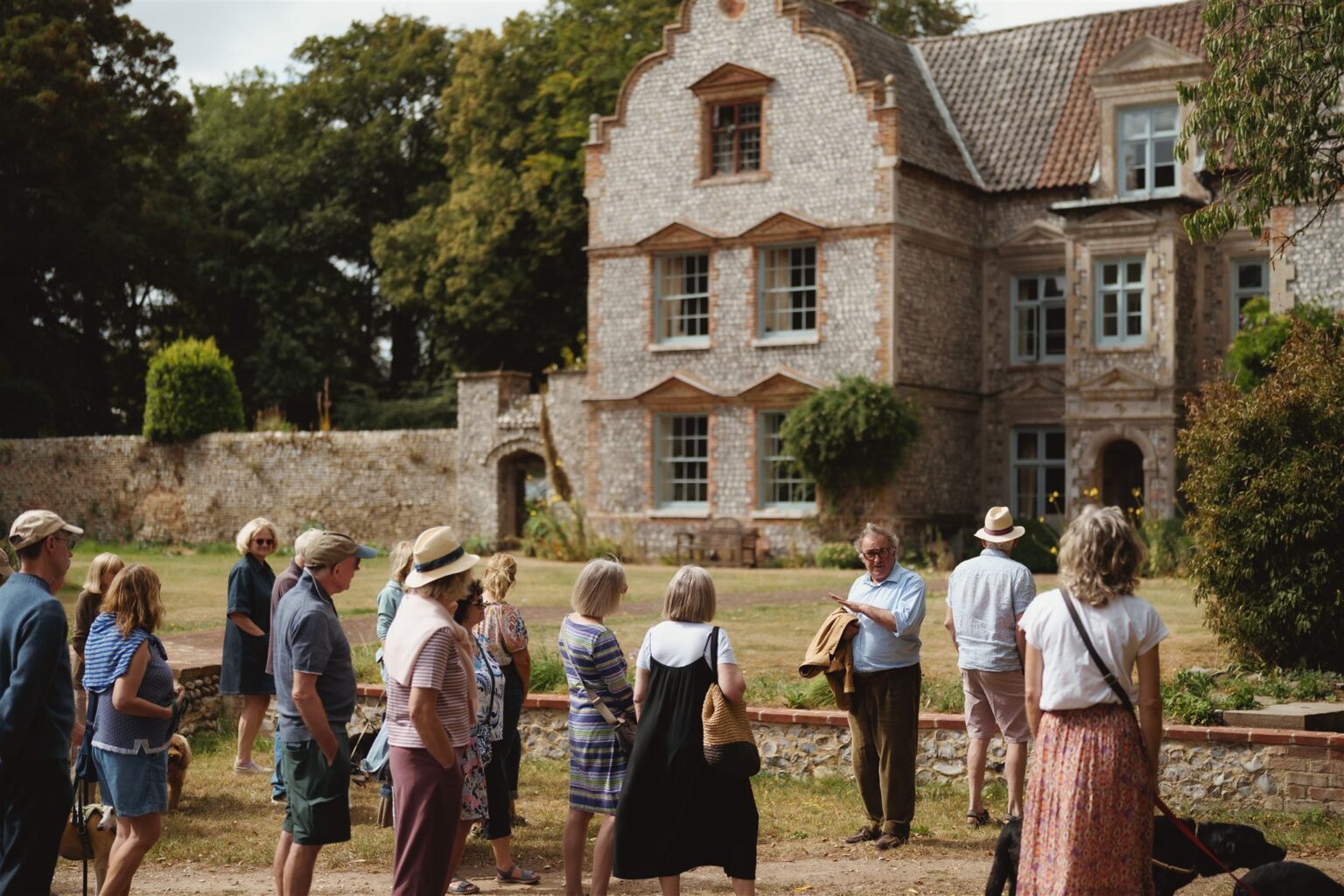 Desmond Maccarthy showing guests around a Garden Tour.